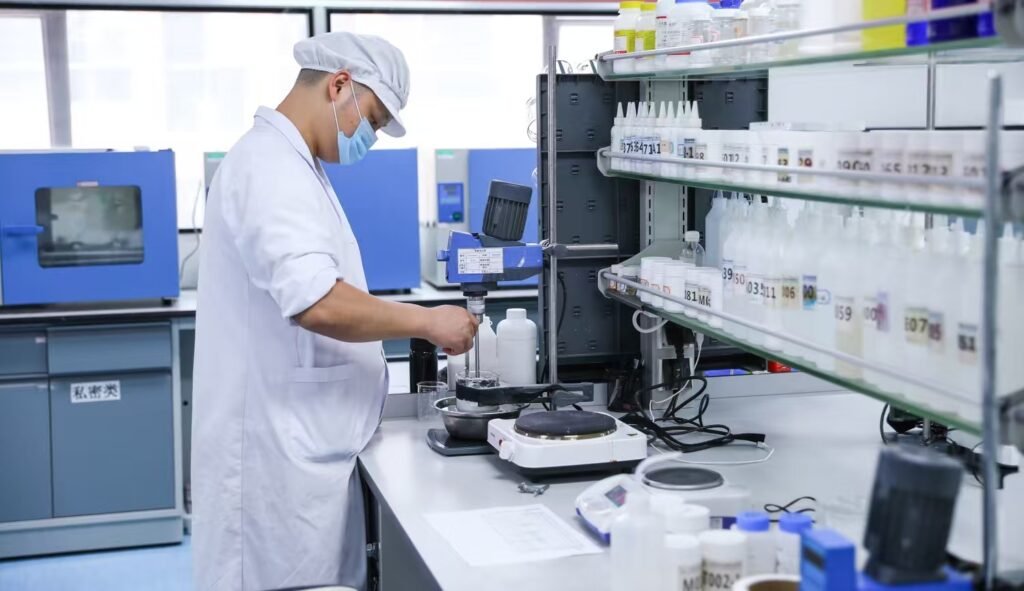 MoCelie QC engineer testing skincare formulations in the factory laboratory